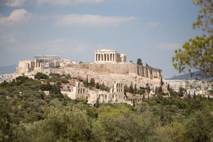 Greece sightseeing travel guide: ancient ruins, rugged mountains, and Mediterranean waters