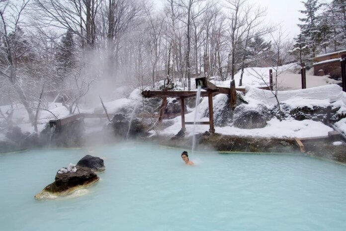 Japan officials raising tax on hot springs bathing as country sees tourism boom