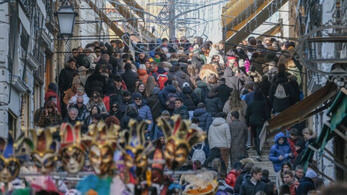 Venice Carnival draws millions of tourists as the city works Venice Carnival draws millions of tourists as the city works to curb overtourism
