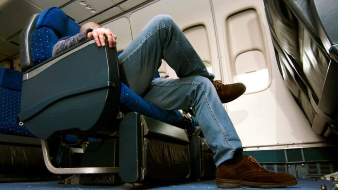 Woman says flight passenger intruded on her legroom space, sparking reactions on social media