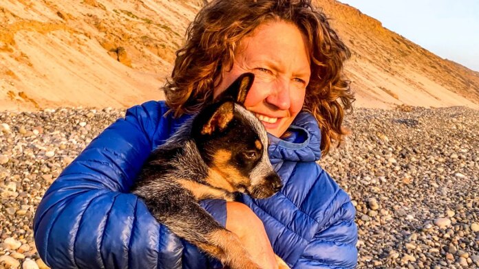 Flea-ridden puppy becomes world traveler with adventurer who had feared dogs all her life