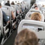 Doctor reveals how to avoid getting sick on holiday airplane flights this season Flight passenger hides suitcase behind curtain as attendants miss the violation