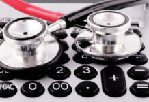 LifeX Research Launches Predictive Analytics Suite for Health Insurance and Wellness Benefits Stethoscopes on a calculator.