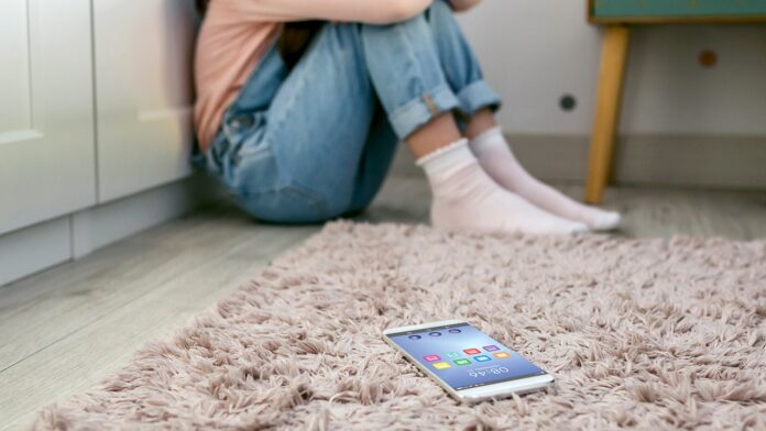 teen-girl-with-phone-on-floor.jpg