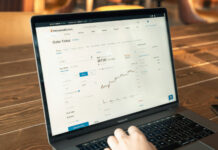 Effective Ways to Increase Your Conversion Rate Person trading stocks on laptop