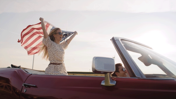 AAA urges early travel planning as it highlights America's 250th Video of woman driving a car with an American flag